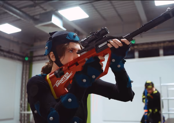 A performer wearing motion capture suit and markers inside XR Studios' OptiTrack motion capture studio in Essex