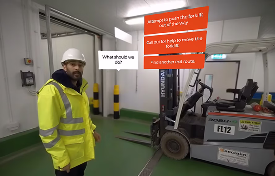 A still from the Thames Freeport emergency evacuation VR simulation training, with a worker in hi-vis and a safety helmet and a forklift in the background.