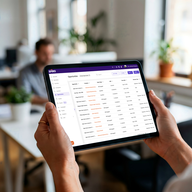 Sales rep viewing Spiro opportunity records on a tablet