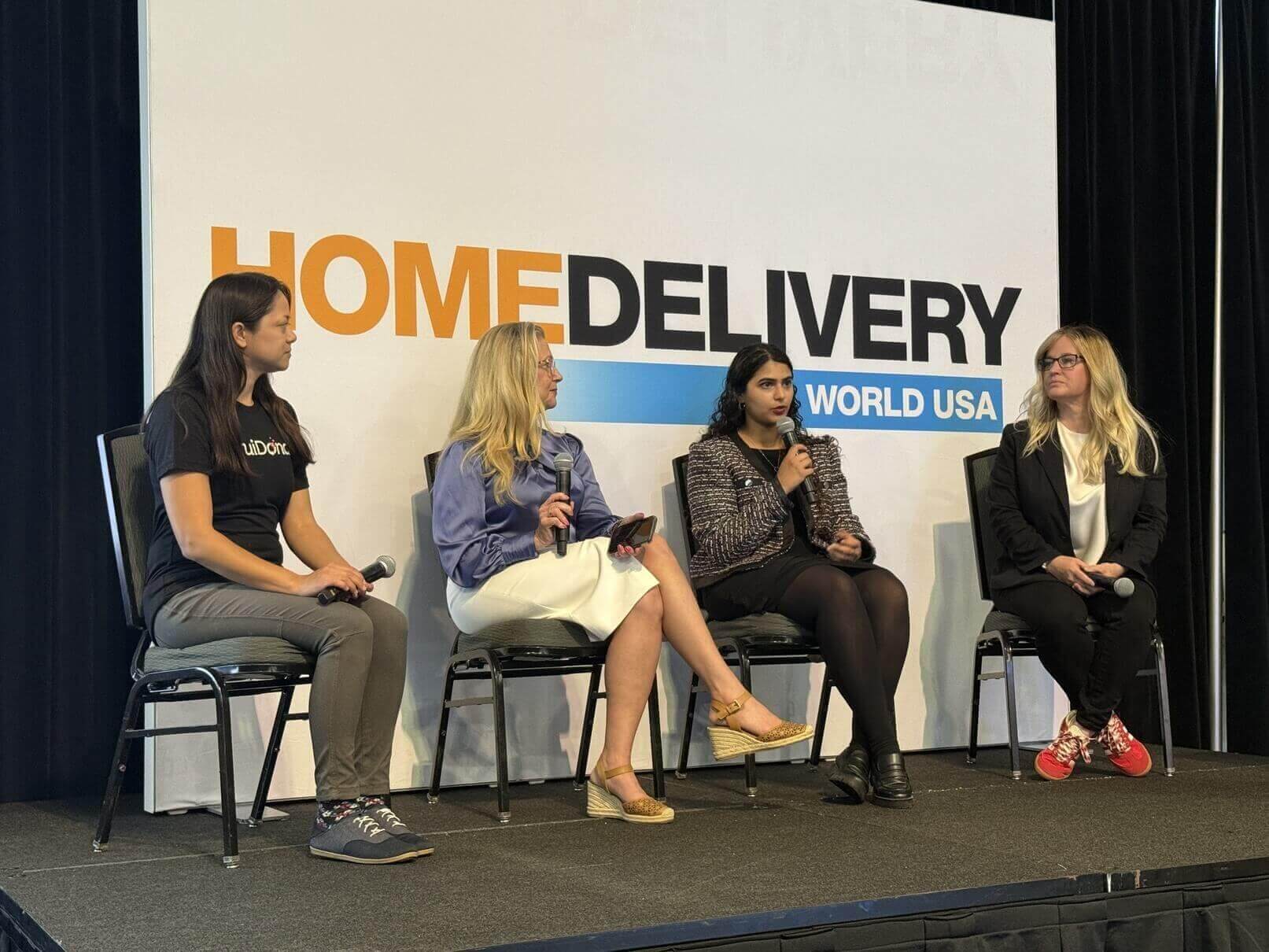 Amrita Bhasin speaking on a panel at Home Delivery World USA