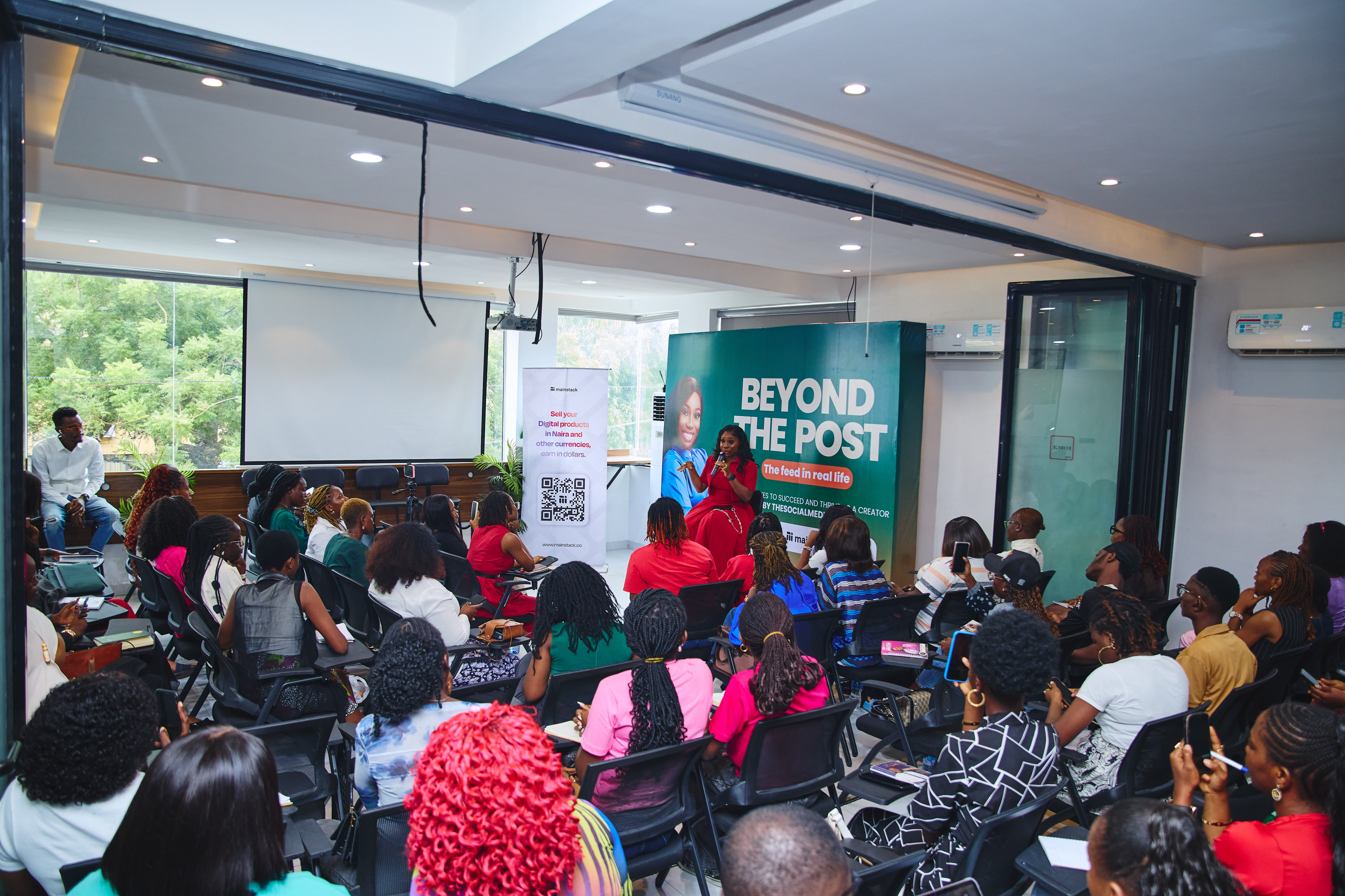 The Social Media Oga seated with attendees at the event