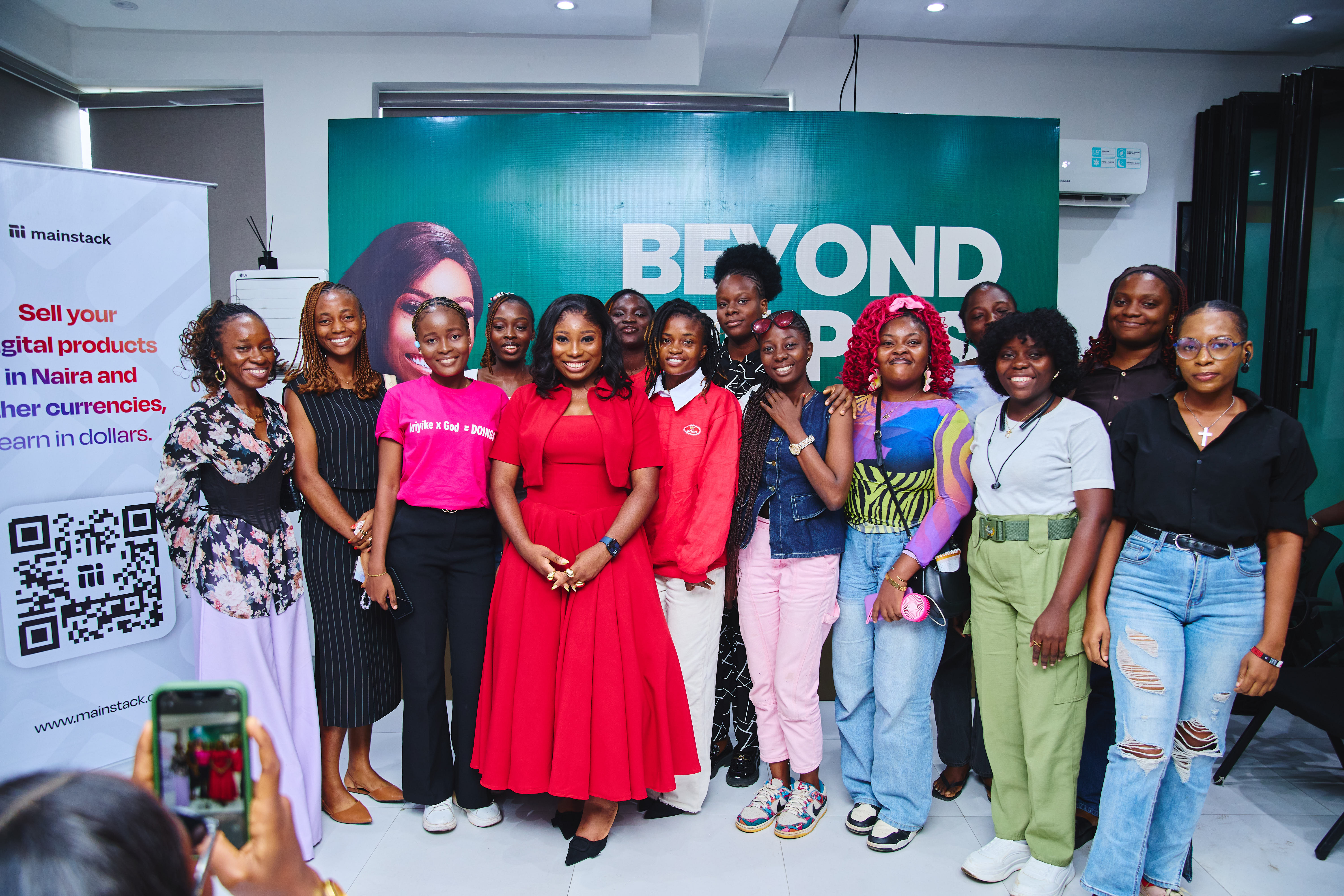 A cross section of The Social Media Oga and attendees taking pictures at the event