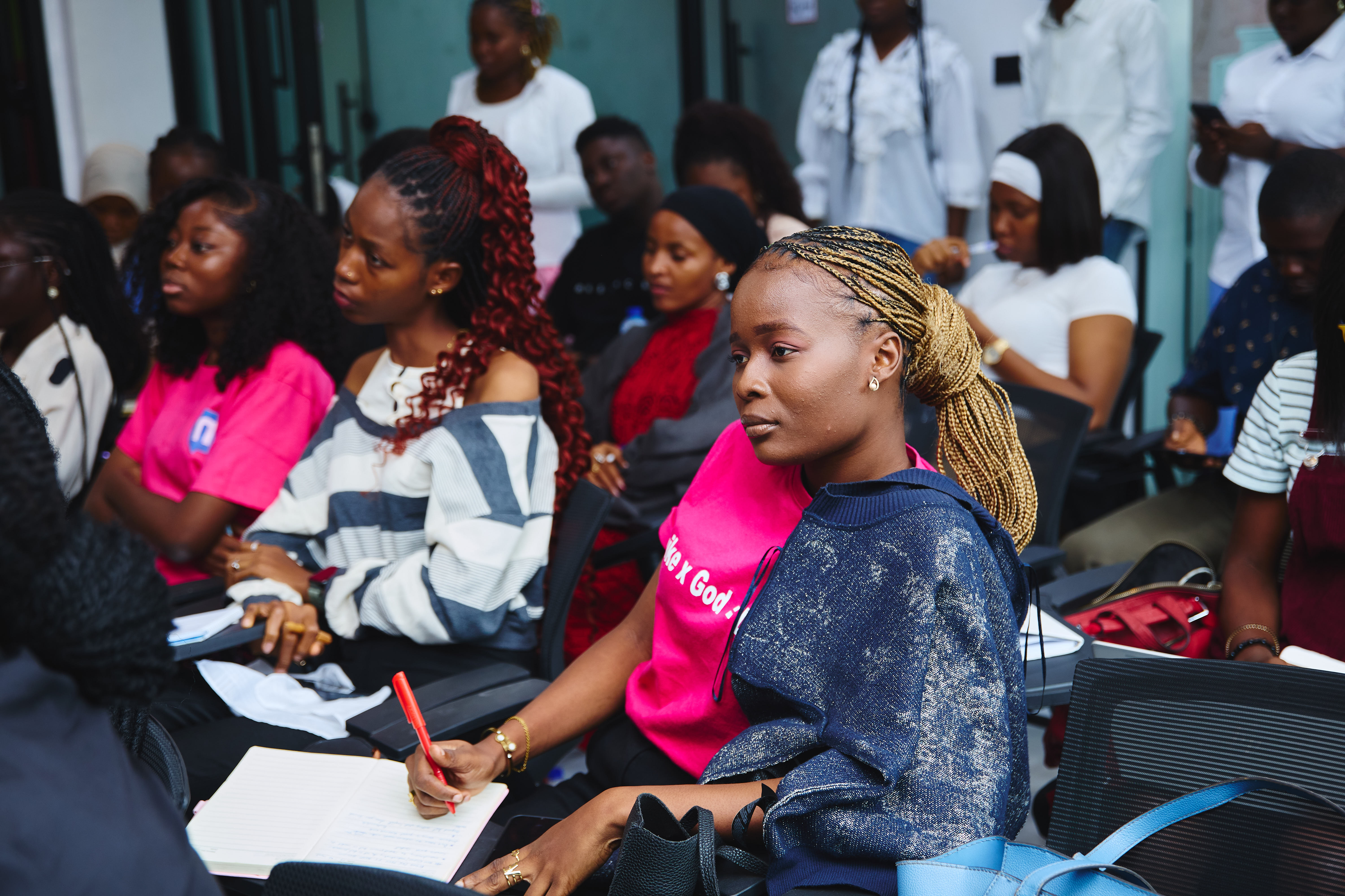 An attendee taking notes during the breakout session with Daniel