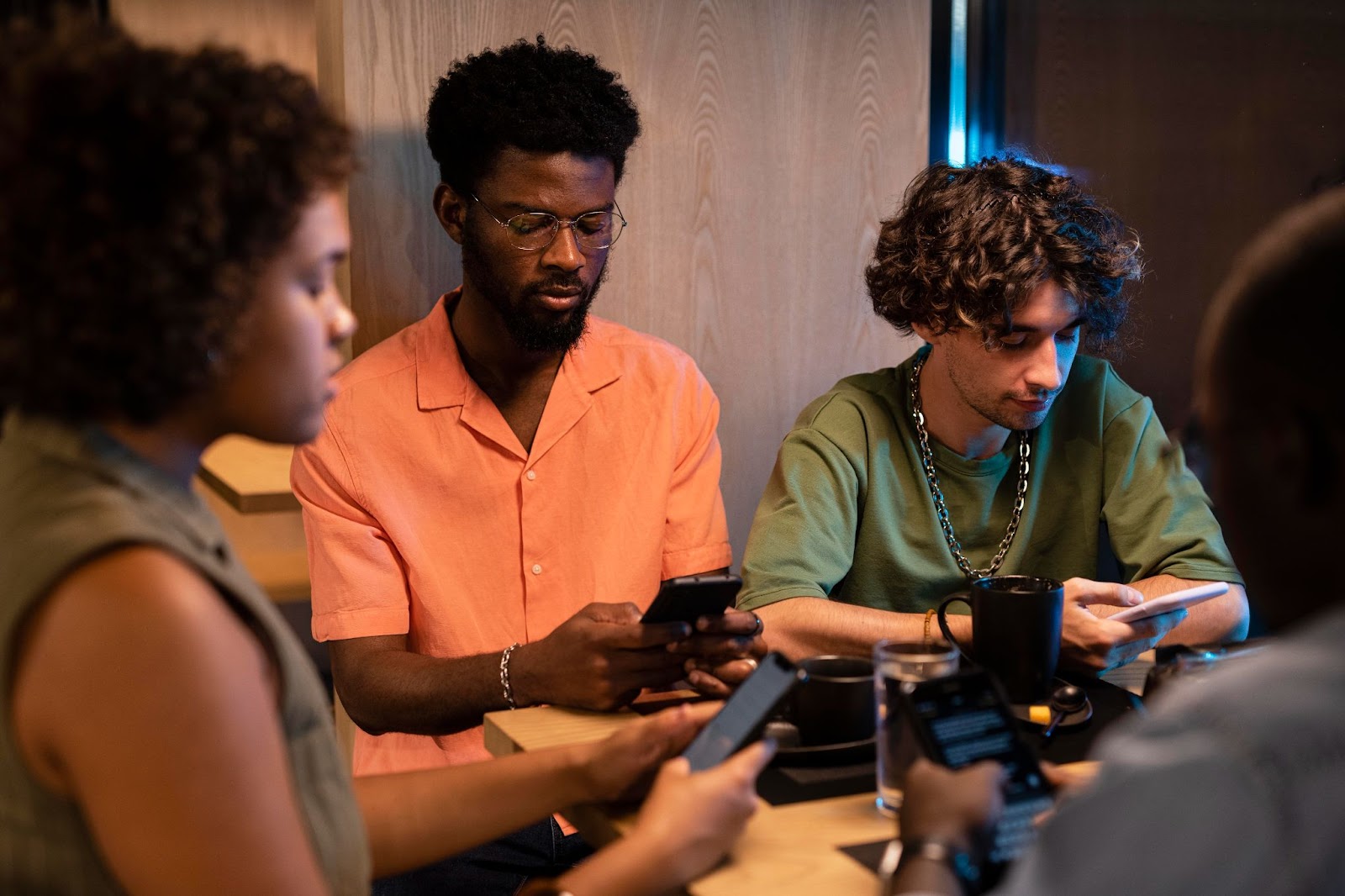 A group of freelancers checking their phones