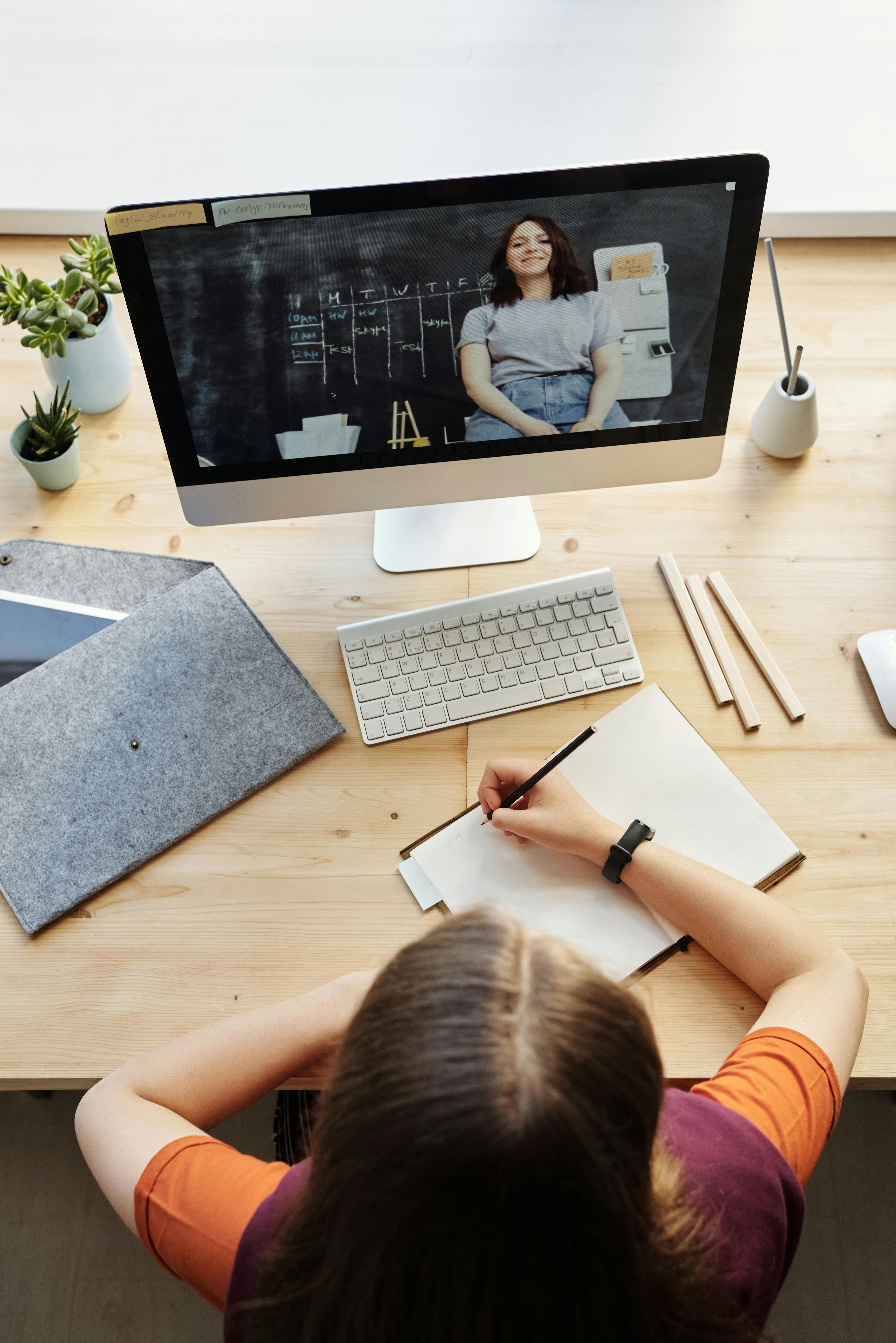 An online tutor and student taking lessons