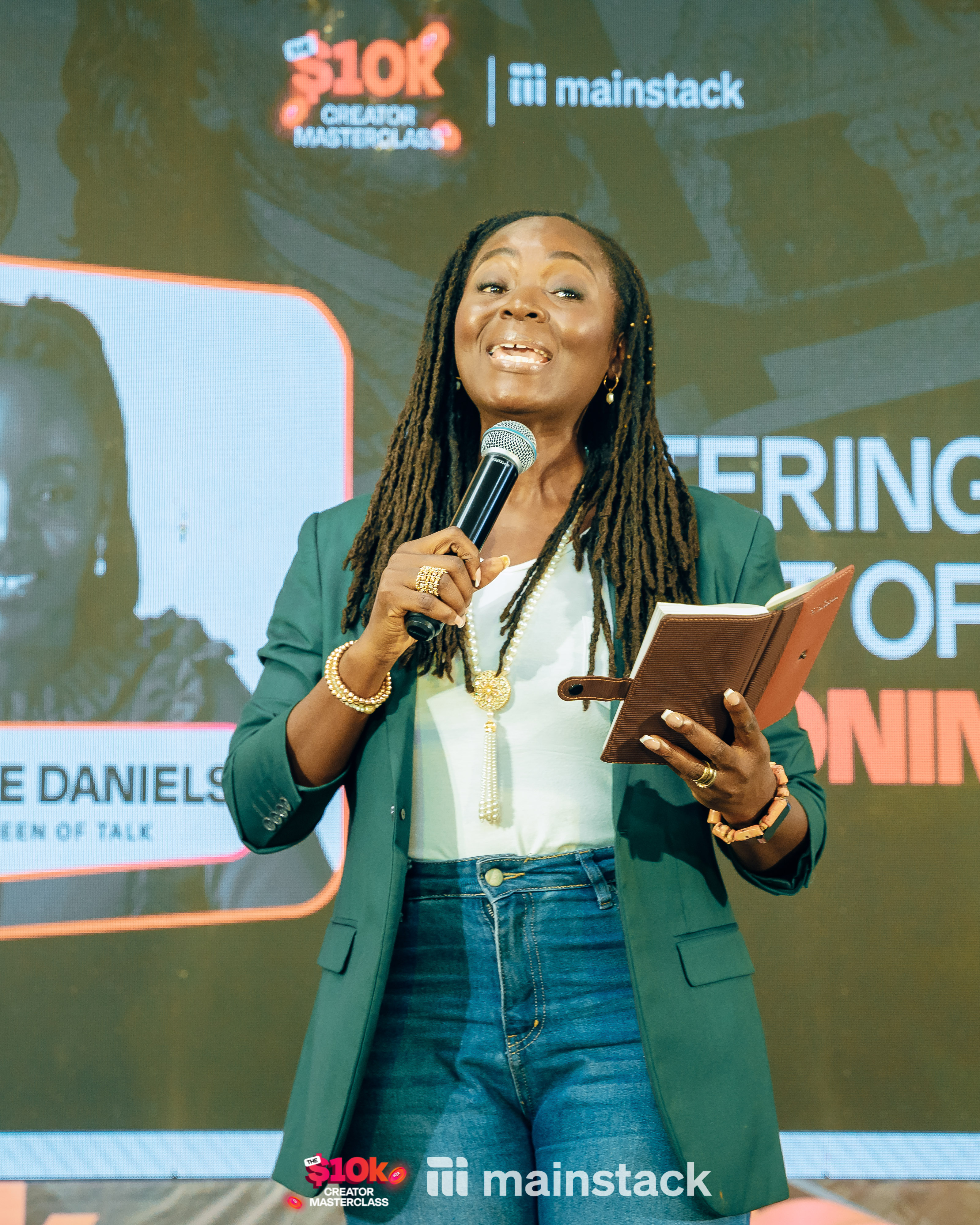 Joyce Daniels giving a practical example to attendees on stage