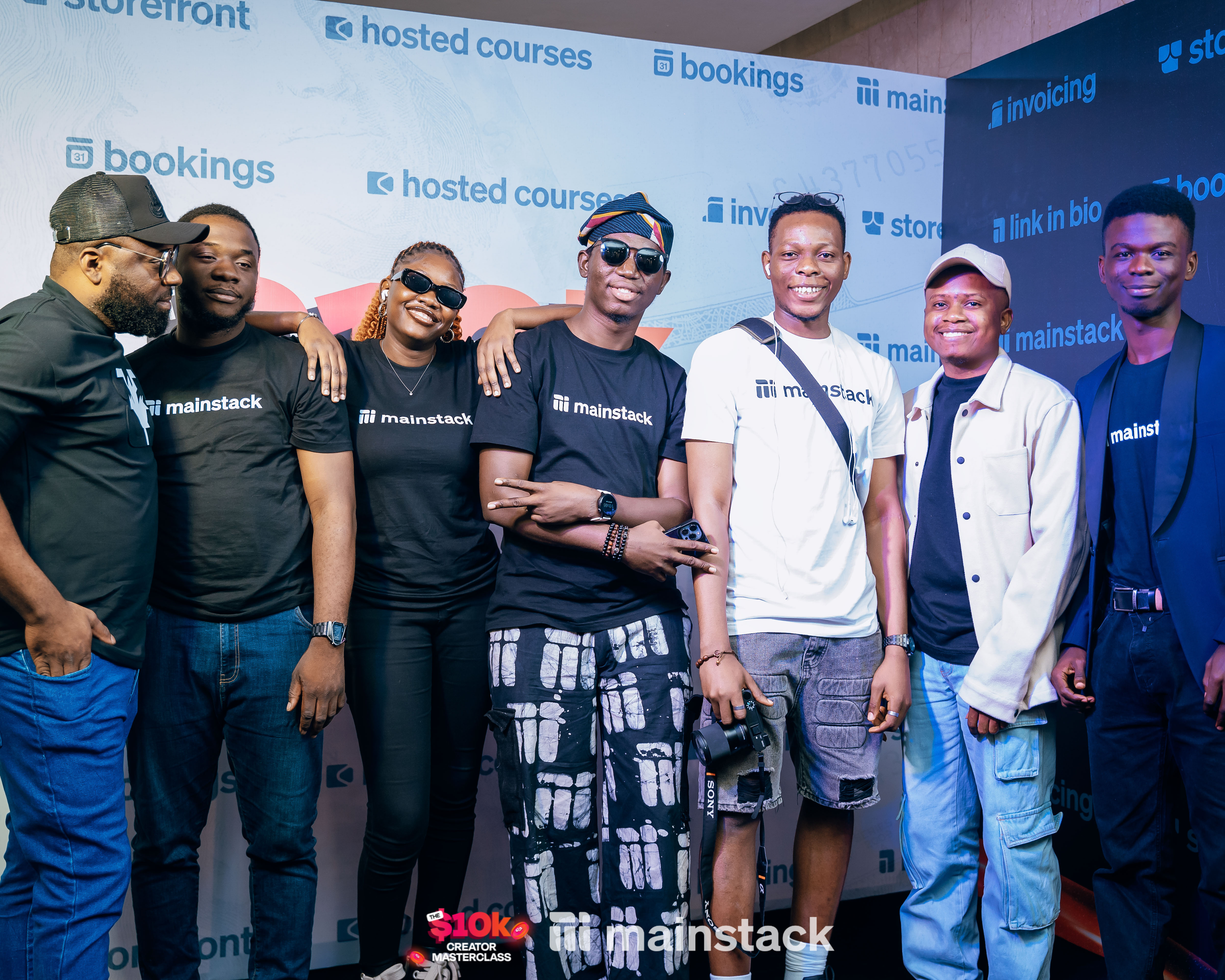 A cross section of Mainstack staff on the 10k Creator masterclass black carpet
