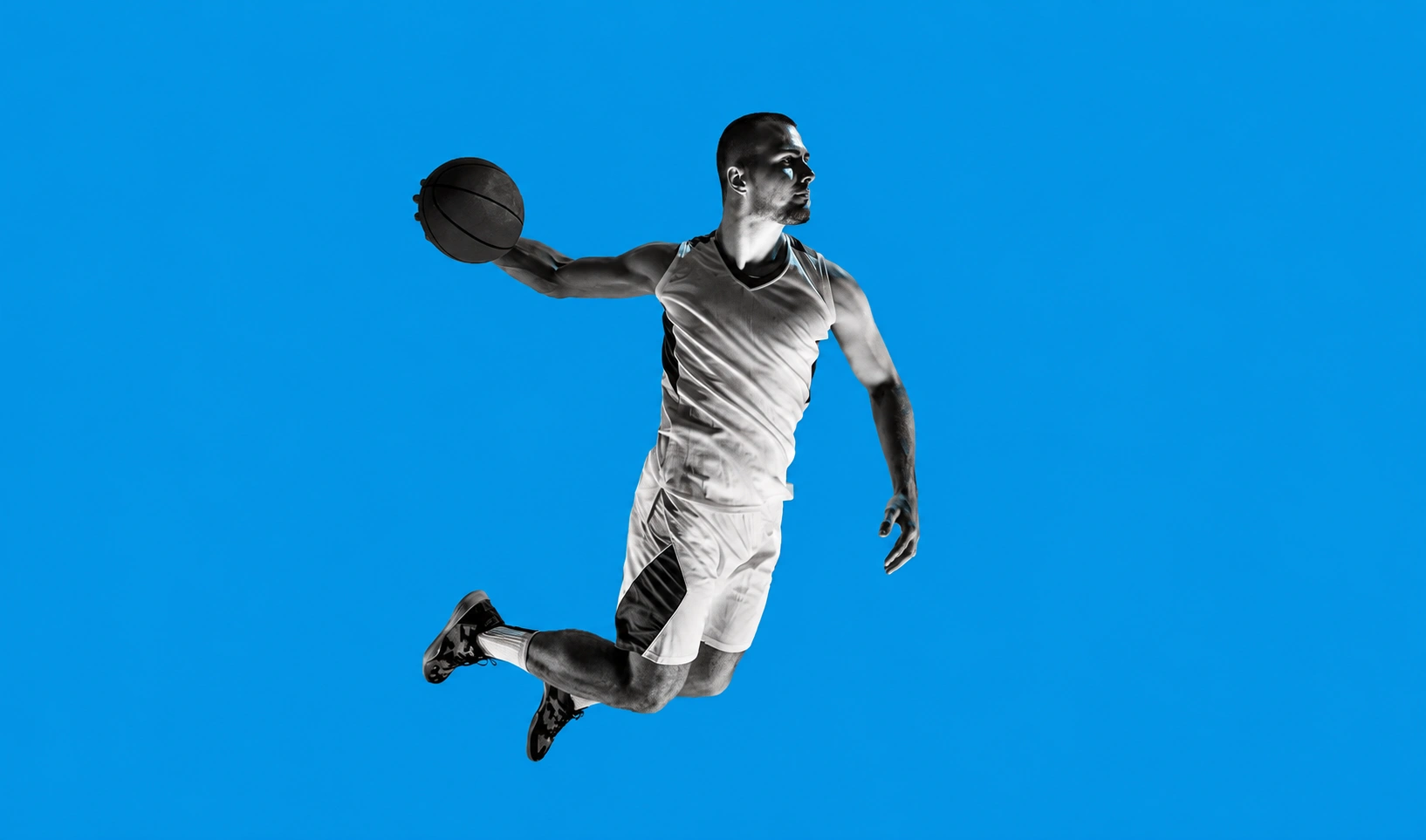 Man in mid air with basketball for Vote in the 2026 Startup Benchmarks Survey