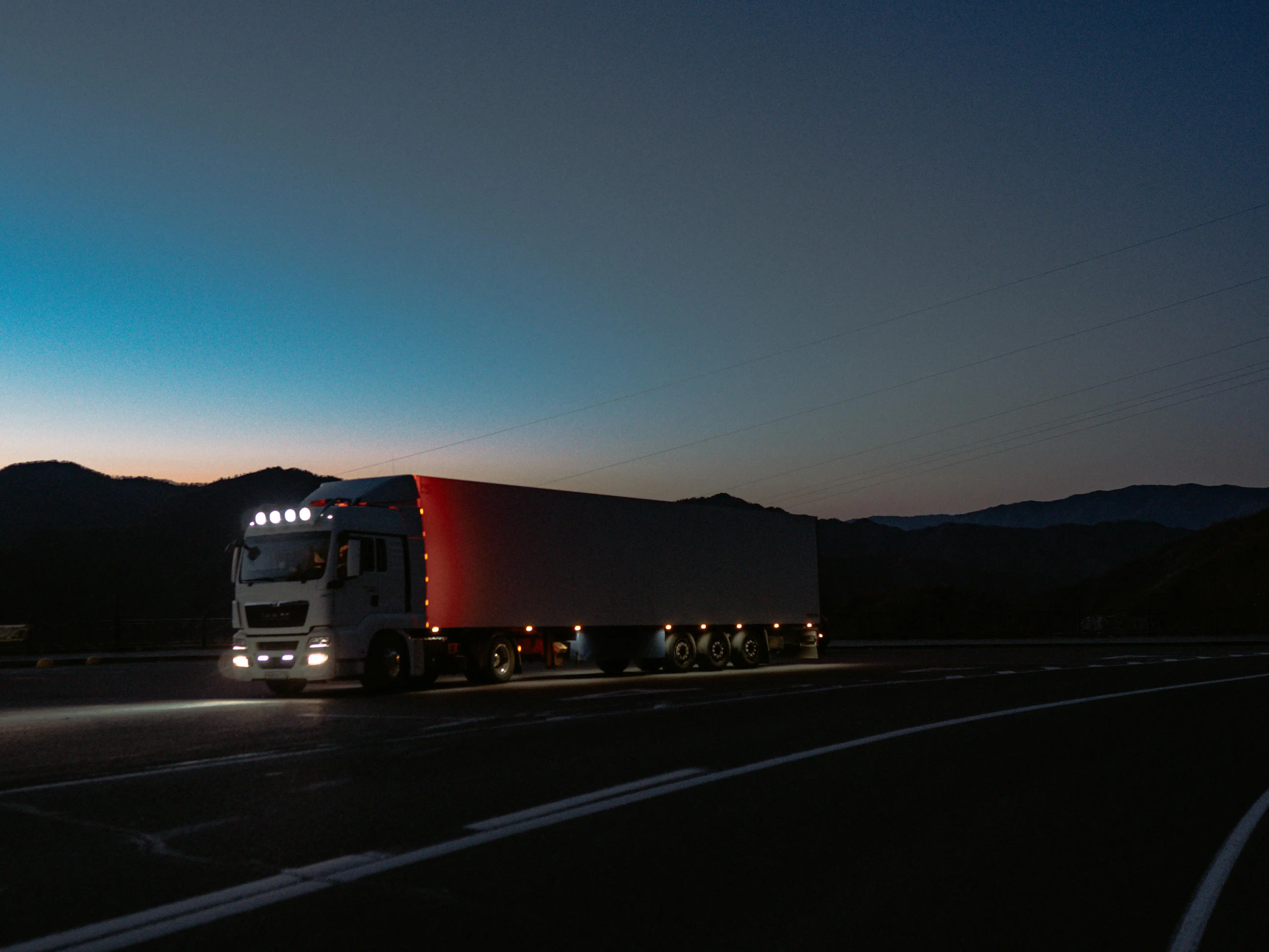 Truck driving at night.