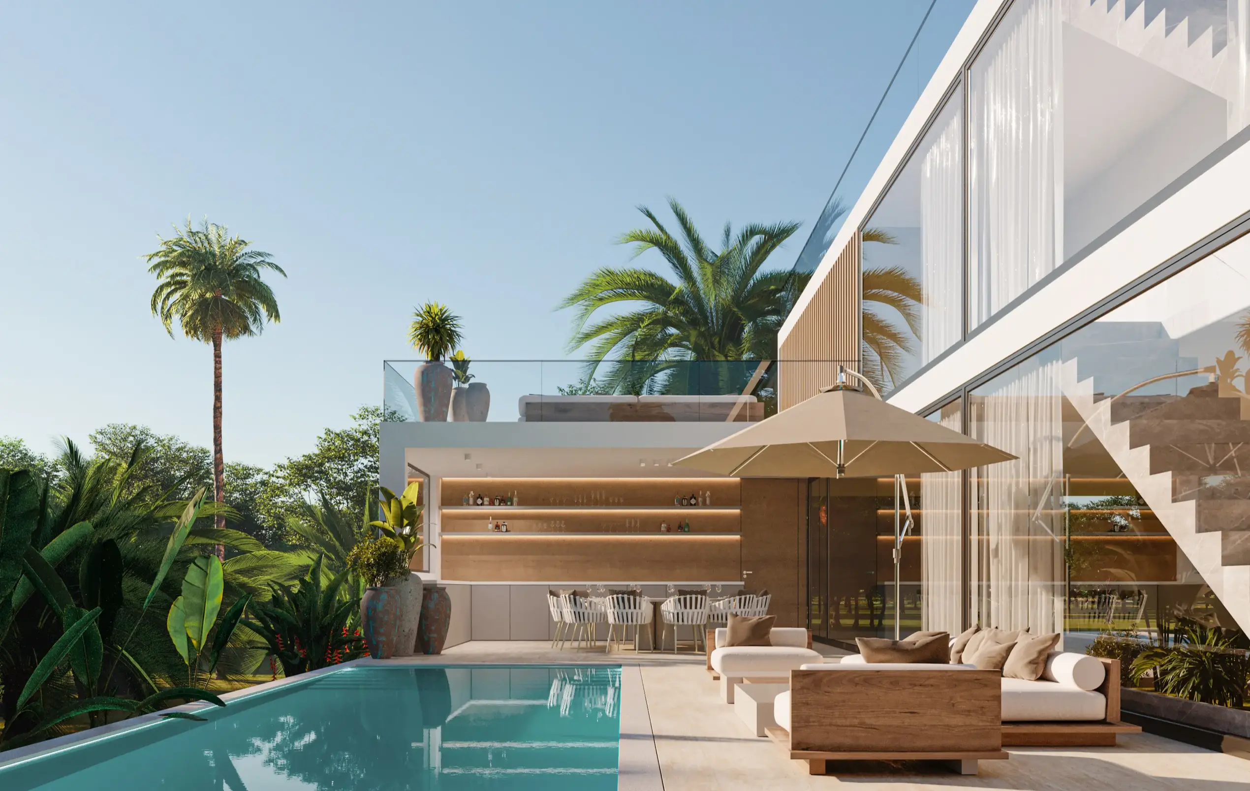 Modern outdoor patio with pool, beige loungers, large umbrella, dining area, and tropical plants against clear blue sky.