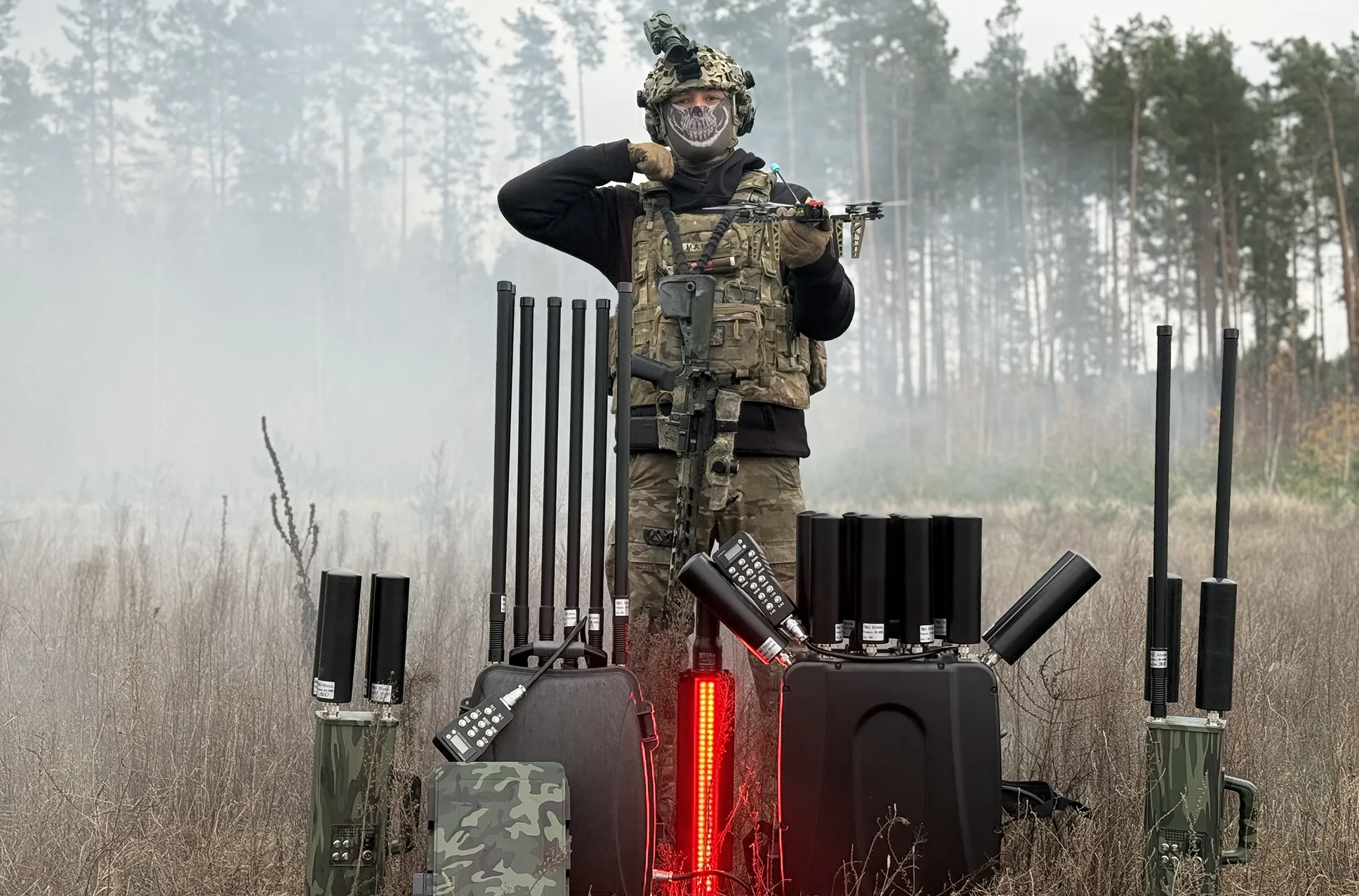 A military man presents Warmax products in the middle of a field