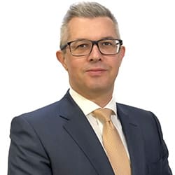 Professional headshot of Neil Riley