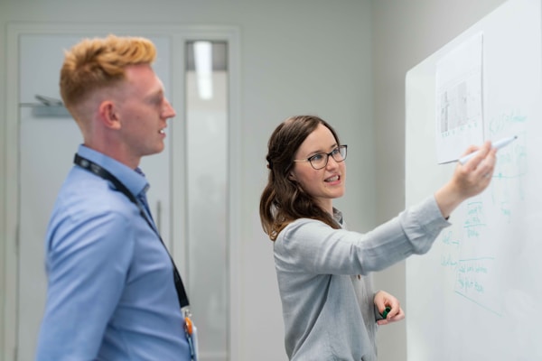 Female electronics engineer in meeting with colleague
