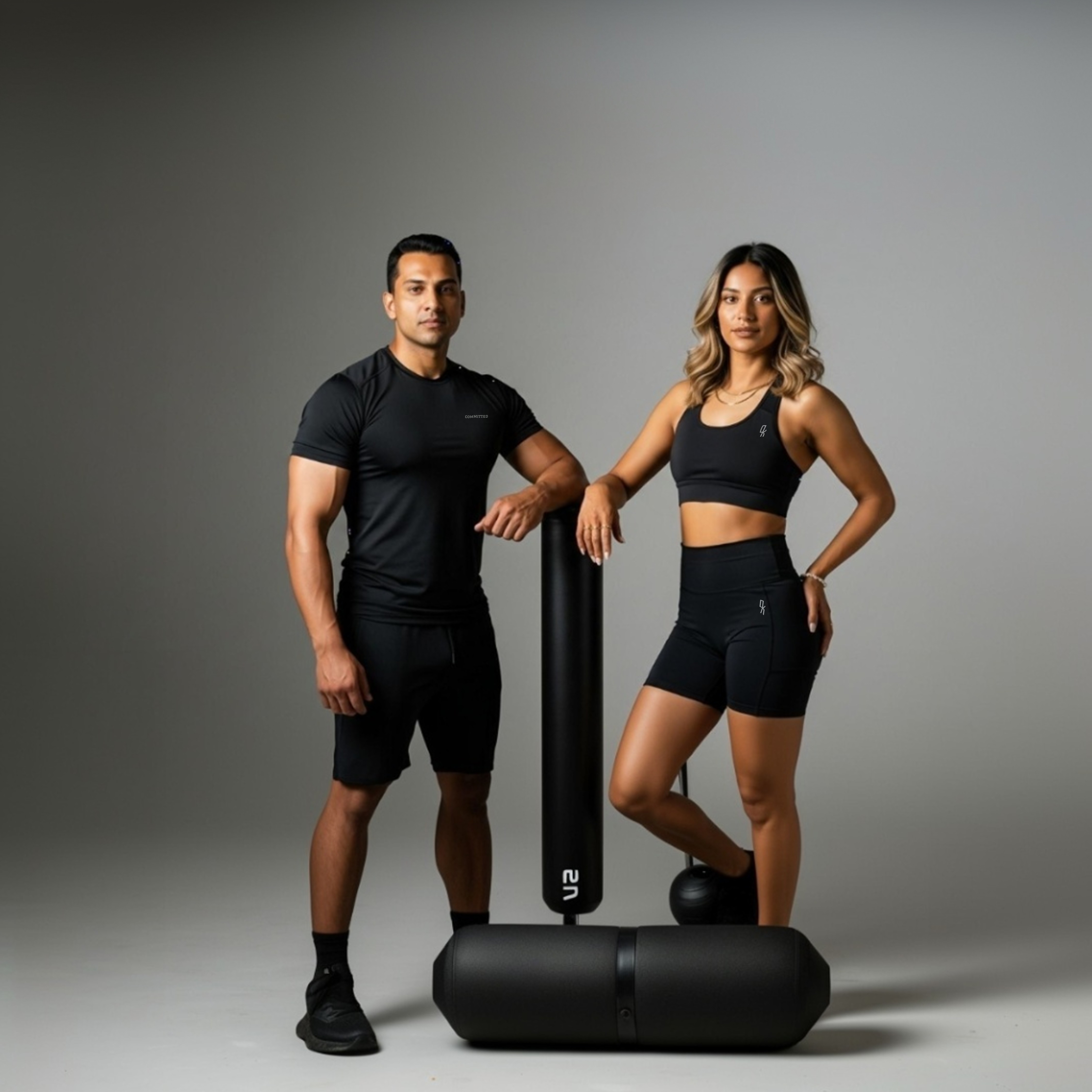 A man and woman posing in okfitt gear