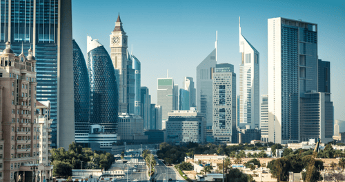 Panoramic view of a modern city skyline with glass skyscrapers