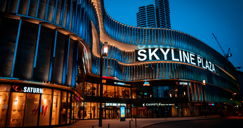 Exterior view of a modern hotel building illuminated at night