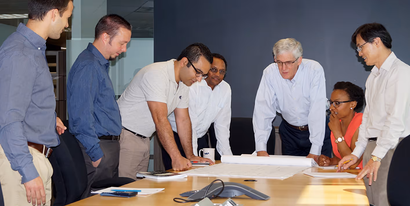 Moffatt & Nichol employees working around a table