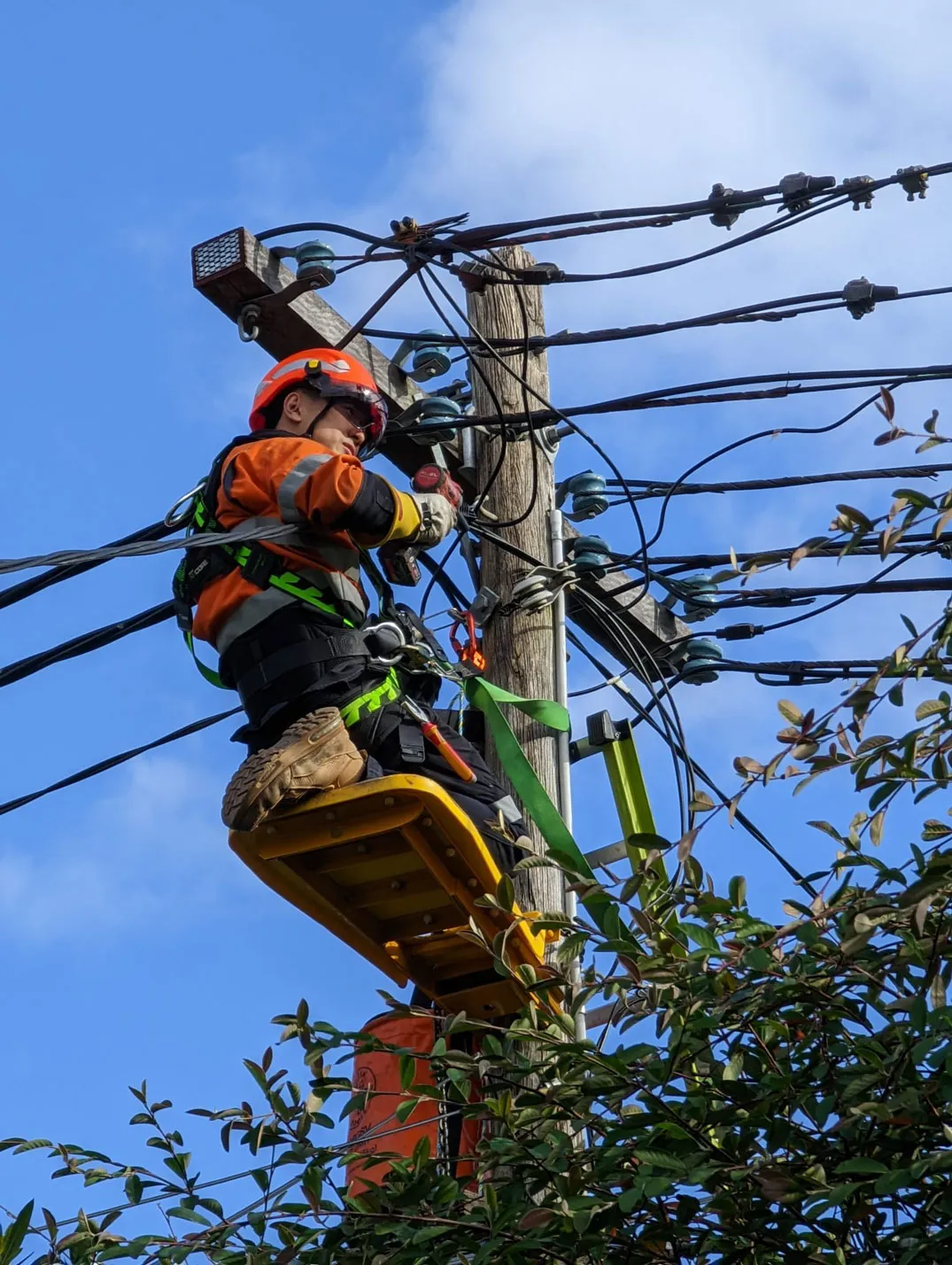 Electrician on electric post