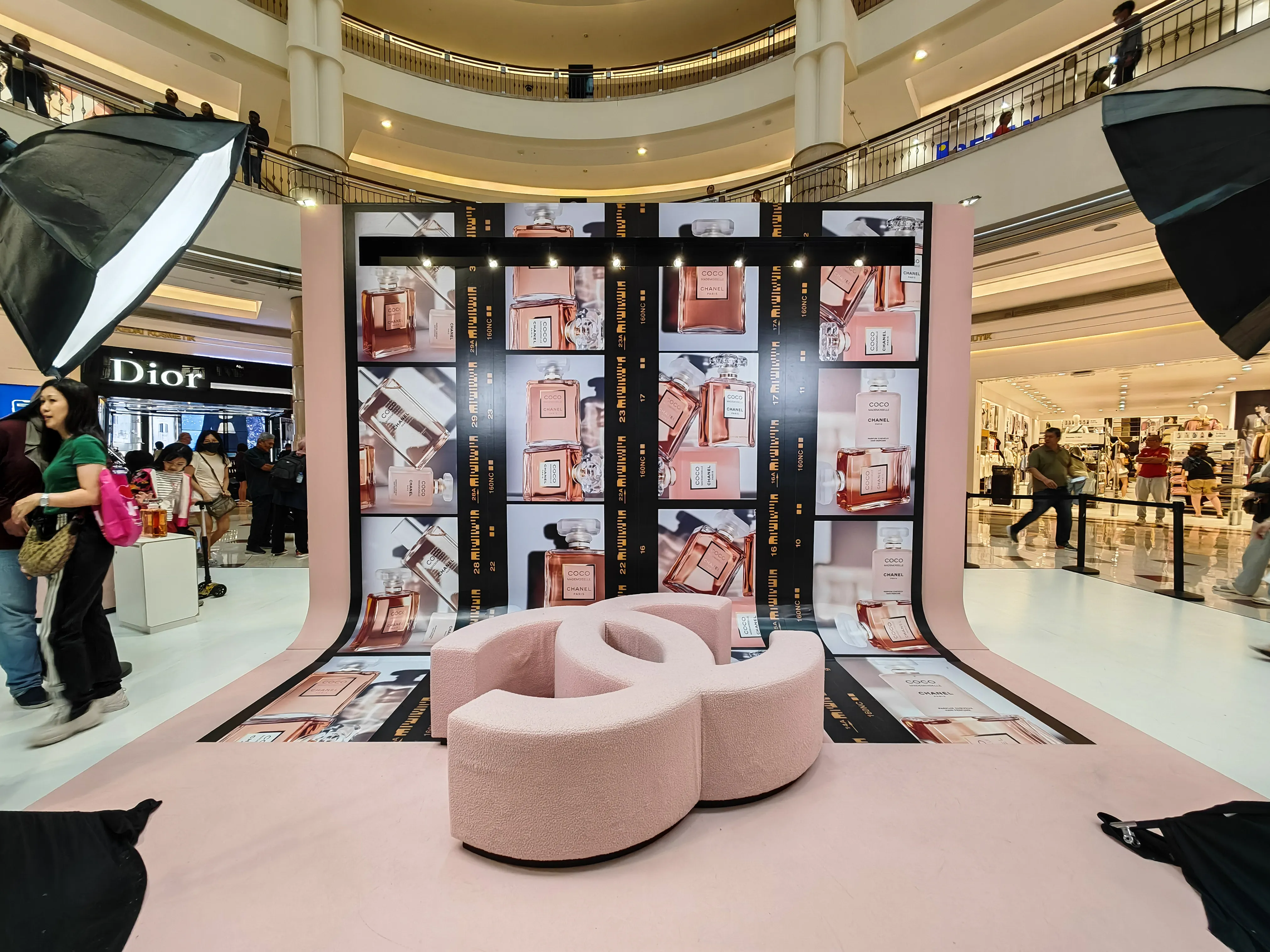 Chanel Coco Mademoiselle fragrance photo wall installation with large logo seating in brand activation event
