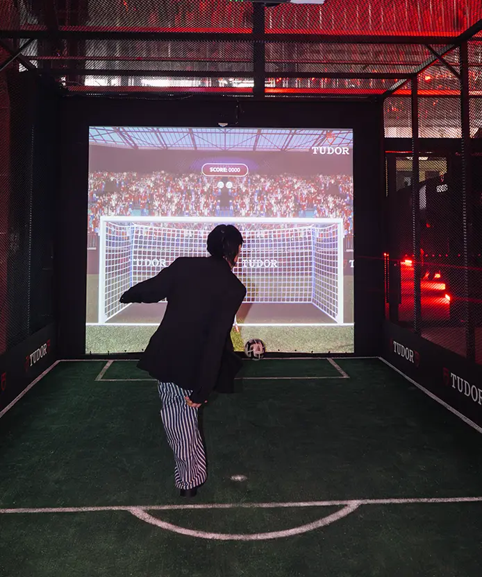 Guest playing the Tudor projection goal-kick game