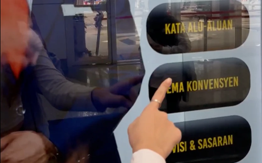 Officials interacting with an interactive hologram AI avatar
