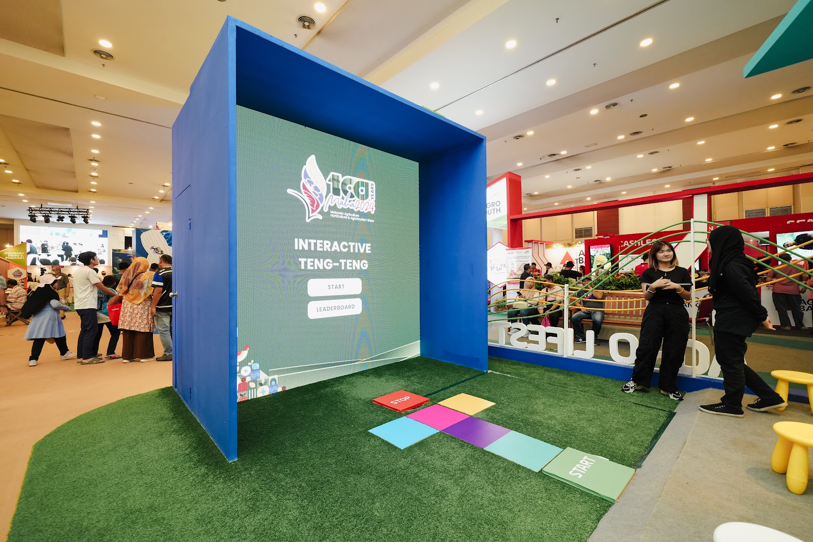 Crowd playing an interactive big screen game at a shopping mall roadshow activation in Malaysia