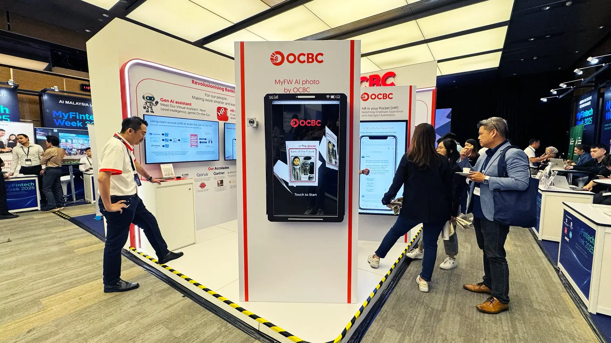 OCBC AI photo kiosk with visitors on the MyFinTech Week conference floor
