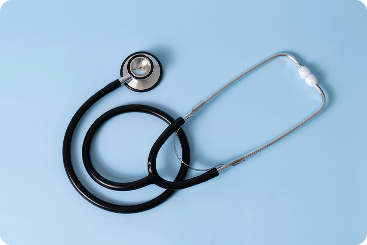 A stethoscope on a blue background, representing doctor referrals and healthcare partnerships.