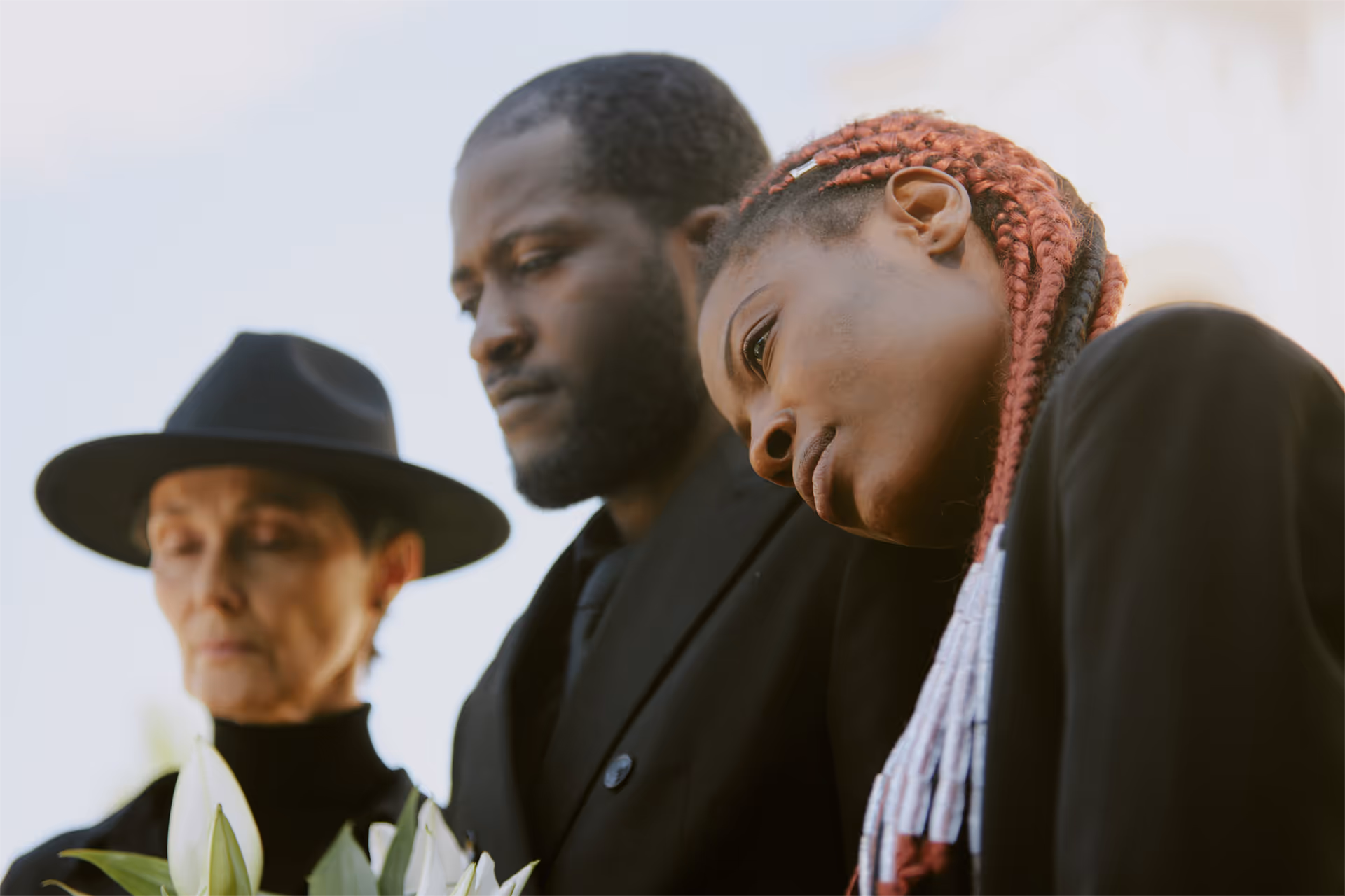 A family grieving at a funeral