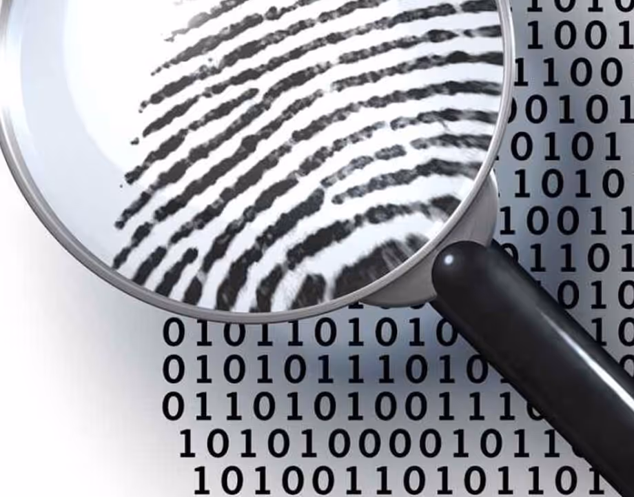 Magnifying glass highlighting a fingerprint over a background of binary code numbers.