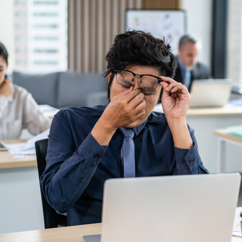 A tired office working is rubbing his eyes, thinking how to manage purchase ordA tired office working is rubbing his eyes, thinking how to manage purchase orders better.ers better.A tired office working is rubbing his eyes, thinking how to manage purchase orders better.
