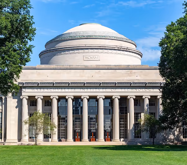Full outdoor shot of the MIT (Massachusetts Institute of Technology) building on a sunny day. 