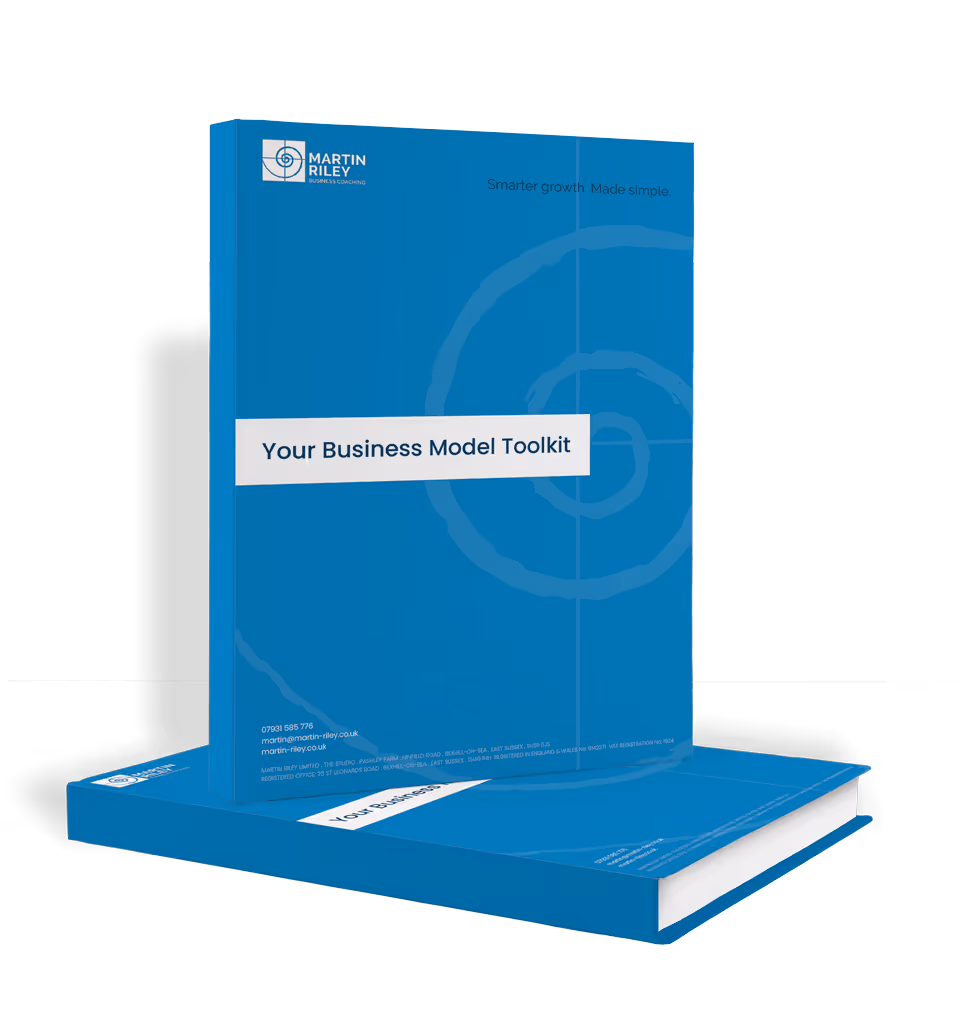 Two copies of a blue book titled "Your Business Model Toolkit" are shown.