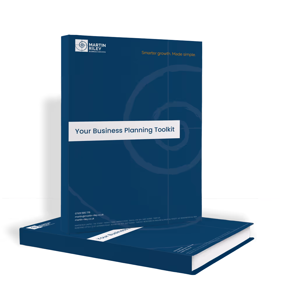 Two copies of a blue book titled "Your Business Planning Toolkit" with a minimalist design on the cover.