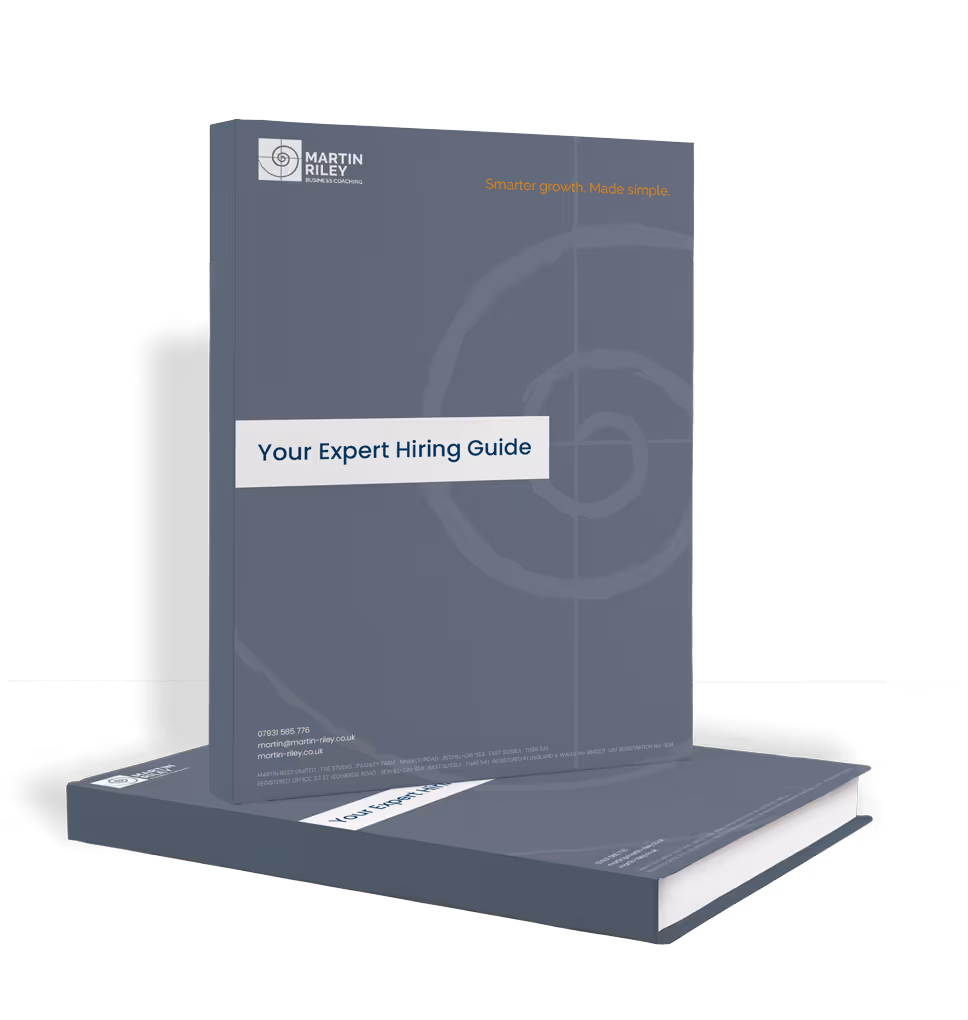 Two copies of a book titled "Your Expert Hiring Guide" by Martin Riley, standing and lying down.