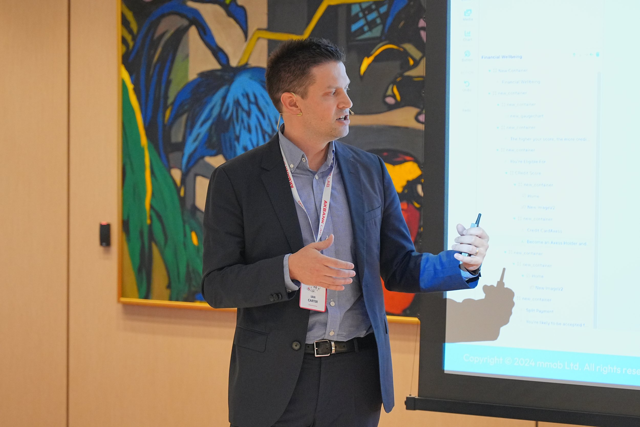 Ian Carter, Group COO of mmob, showcases mmob's solution in the context of AkBank in front of AkBank stakeholders at AkBank lab.