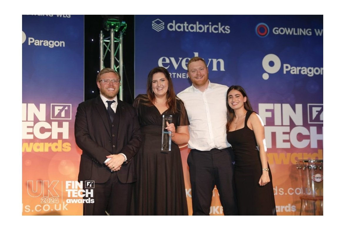 mmob and Level colleagues accepting the award onstage from comedian Rob Beckett.