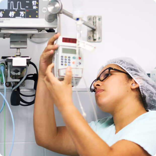 Biomed worker installing a monitoring device
