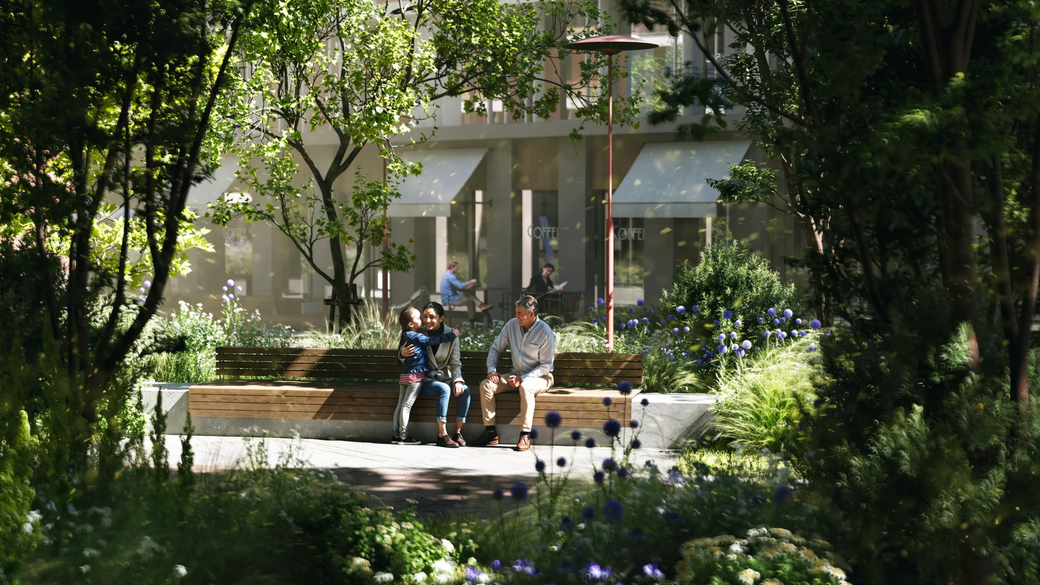 A family sitting on a wooden bench in a city park surrounded by greenery and purple flowers, with a coffee shop in the background.
