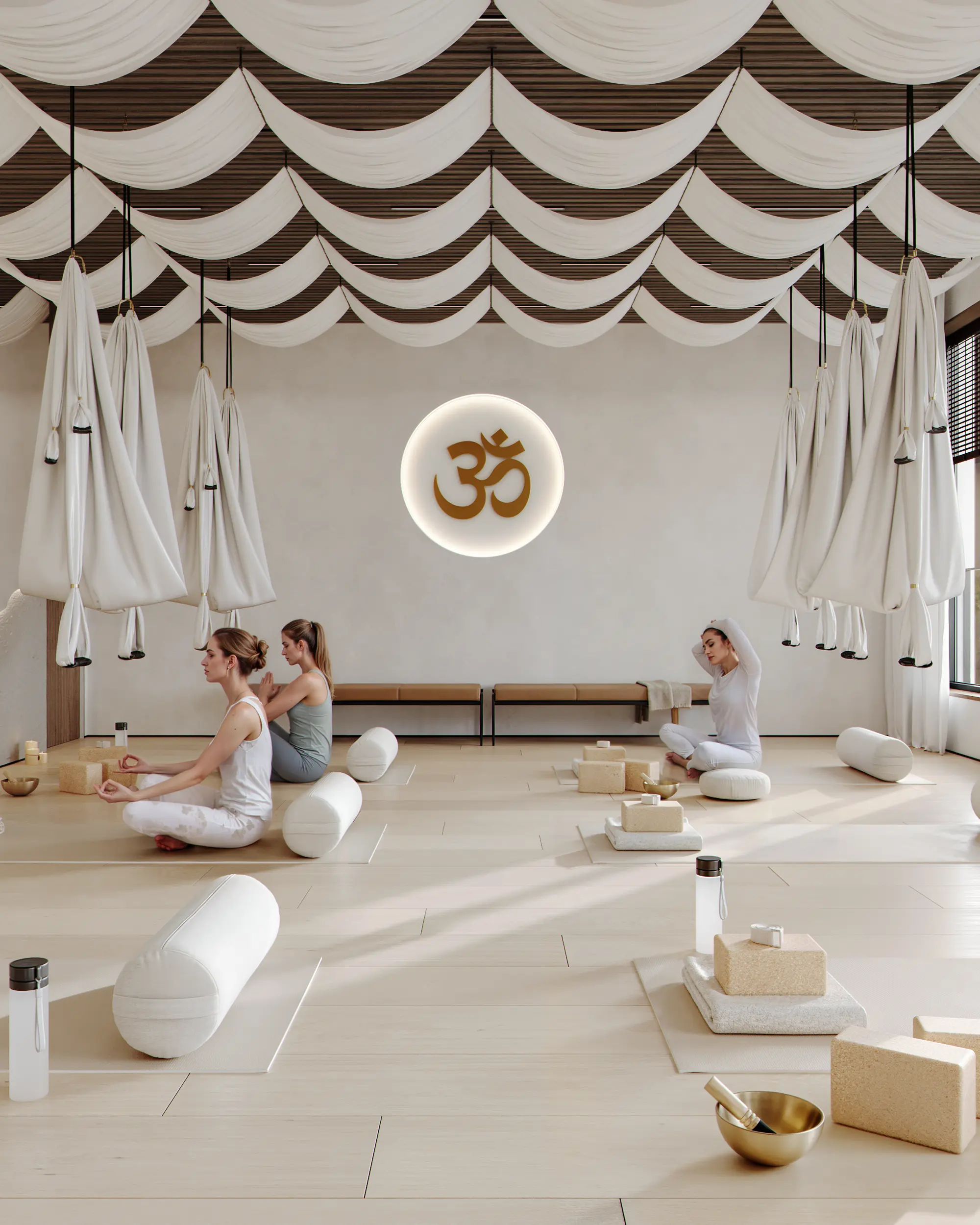 Yoga studio entrance with waiting benches, logo, and a view of the practice area.