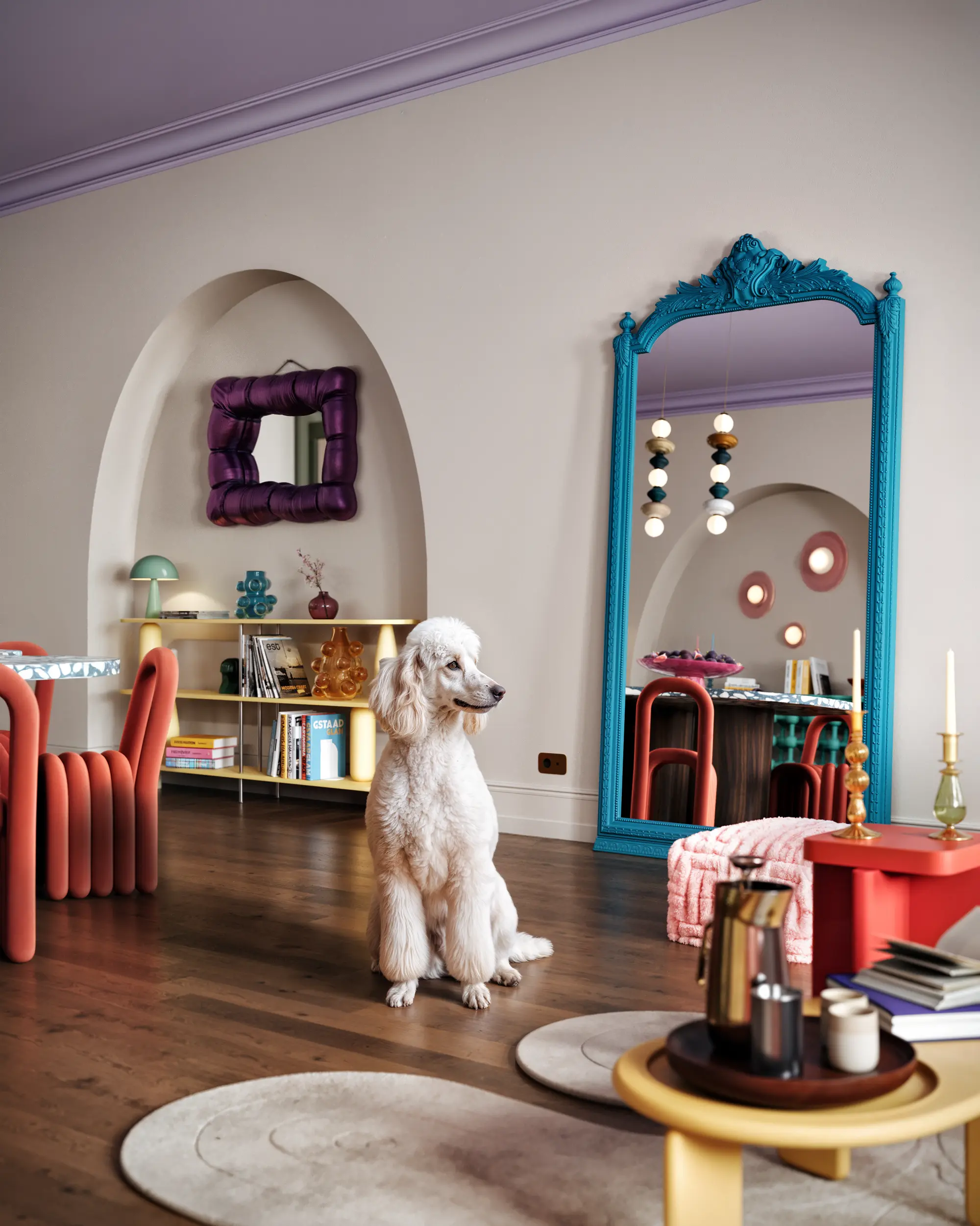 Chic Pop Art dining corner with a stylish sideboard, round mirror, and a white poodle statue.