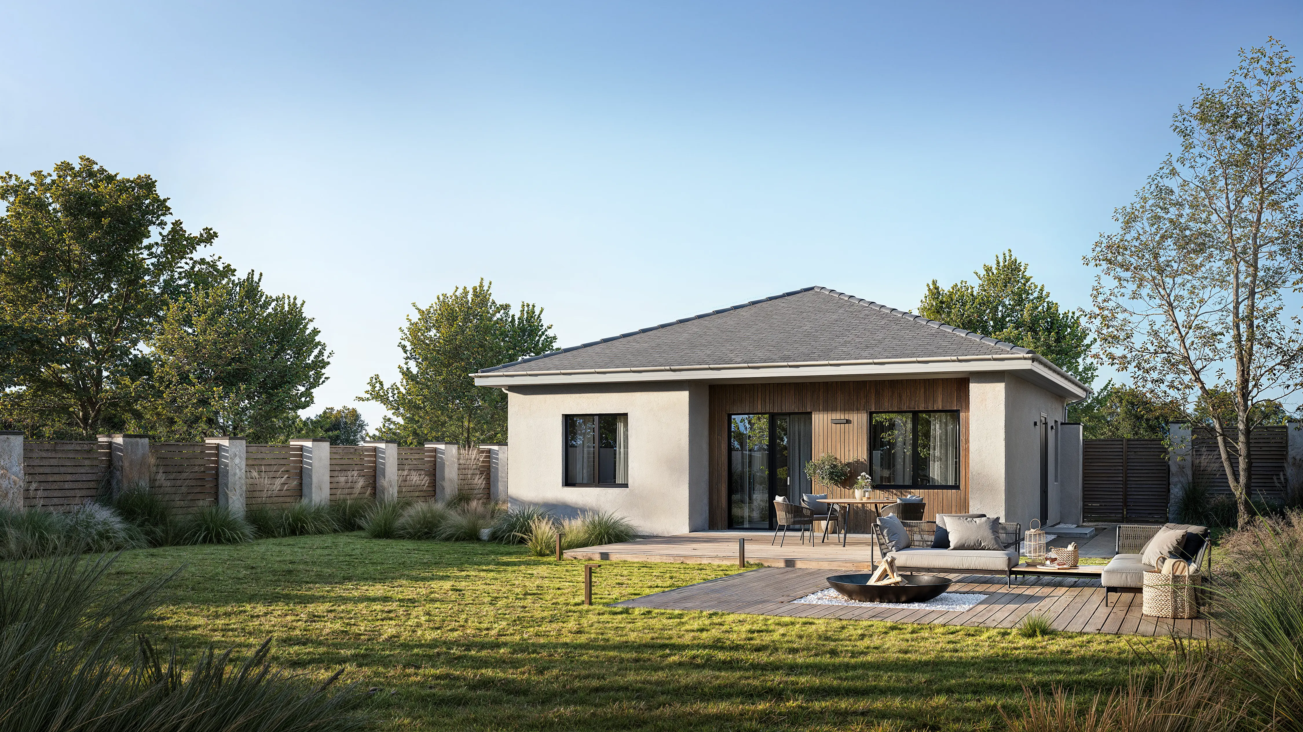 View of a house with a BBQ relaxation zone and sofas.