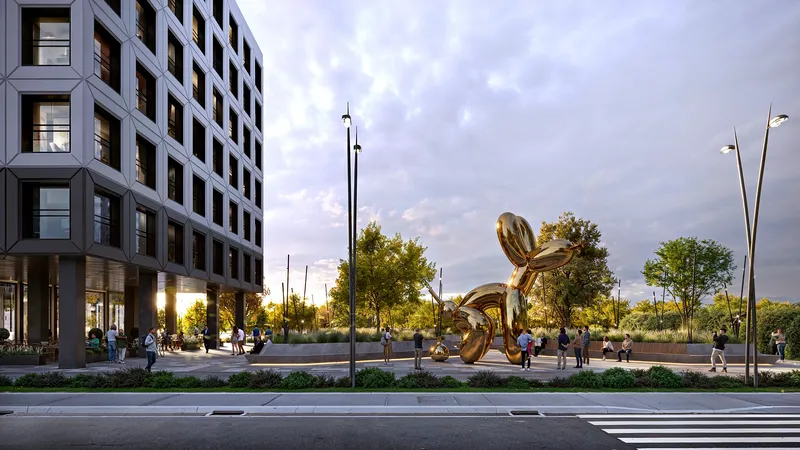 Modern public plaza in front of a residential building, featuring a large contemporary art installation.