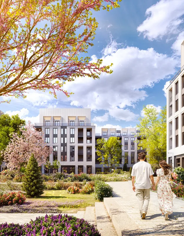 Fresh spring atmosphere in residential complex with blooming nature and walkway