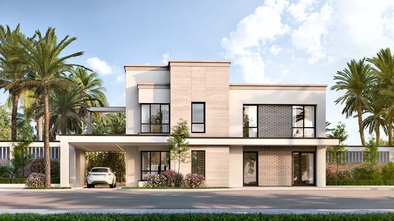 Front view of a modern light stone townhouse with a covered parking space.