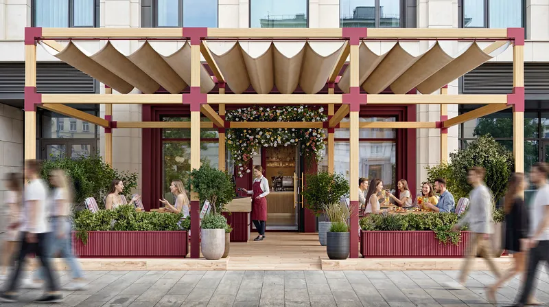 Summer cafe veranda with waiters serving customers.