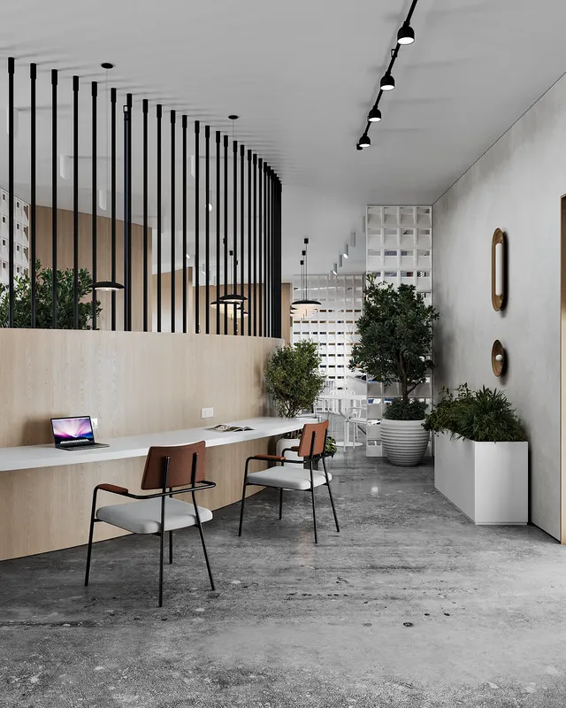 Welcoming modern reception area with a staff member at the desk.