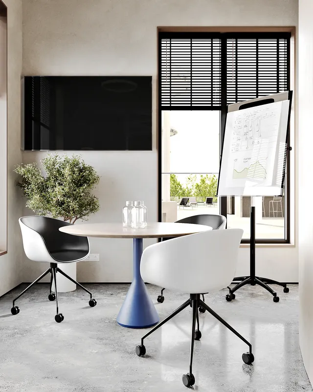 Intimate four-person meeting room, ideal for small team collaborations.