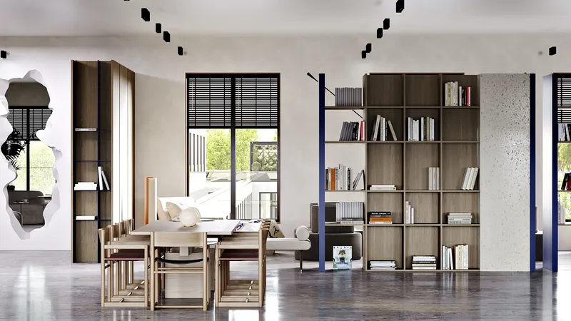 Bright common area featuring a large meeting table and custom shelving by the window.