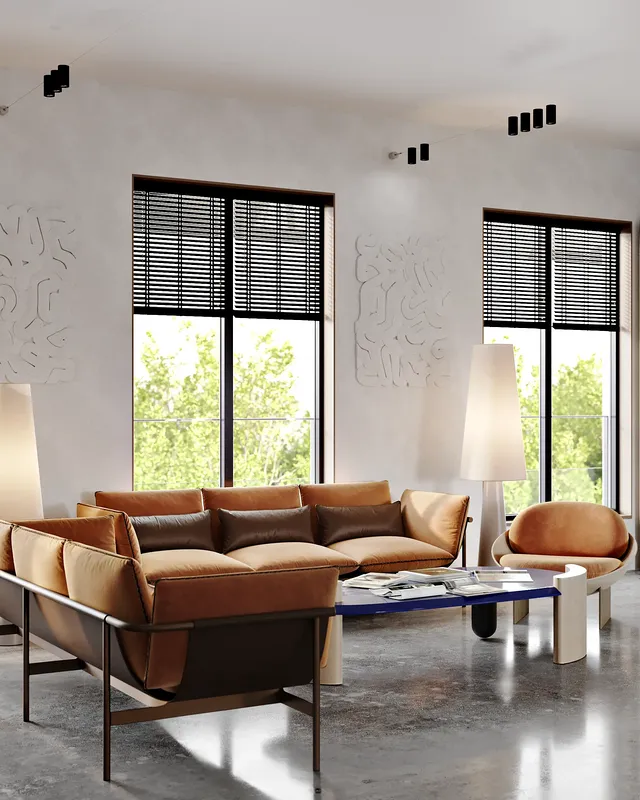 Cozy dining nook by a window, featuring a table and a comfortable banquette sofa.